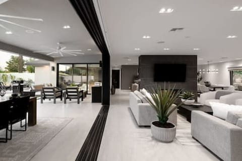 Large Multi-Slide Window Doors + Main Living Area + Outdoor Covered Patio