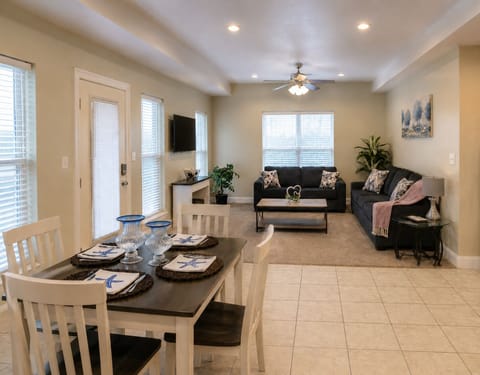 Bright open living space with cozy seating and dining for four
