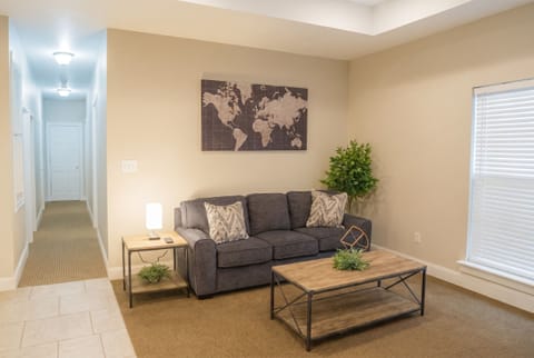 Bright, cozy living room with modern décor and plenty of natural light