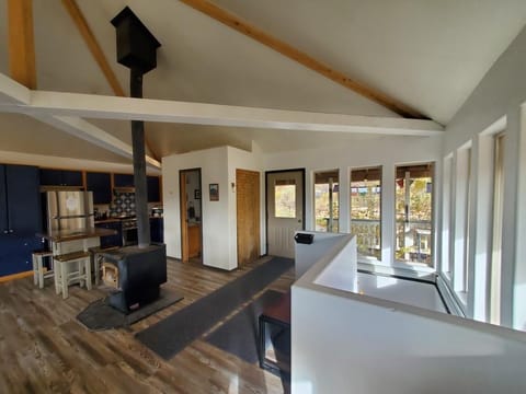 Stairway down to main floor with bedrooms, laundry room, full bath, door to yard