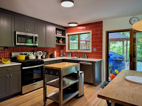 Sleek, modern kitchen featuring updated appliances—fully equipped for your culinary adventures.
