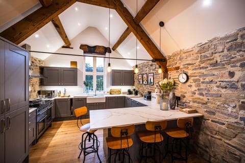 The stunning kitchen has vaulted ceilings, original beams and lots of light.