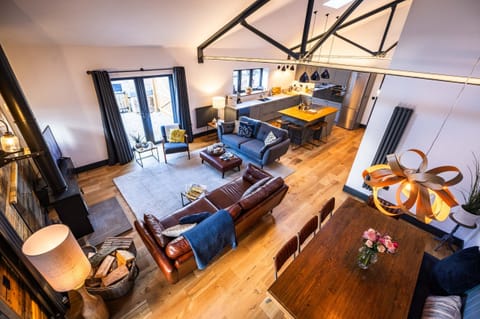 Living Space - has vaulted ceilings, exposed beams and a reclaimed timber wall.