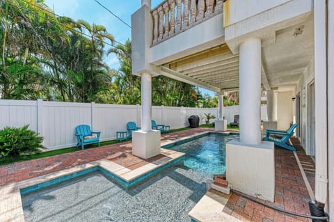 Large heated pool runs under the balcony