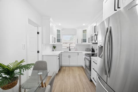 Bright and open kitchen layout -easy for cooking and hanging out together.