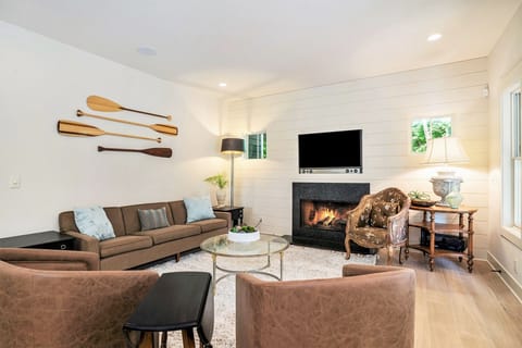 Family room with large TV and seasonal gas fireplace