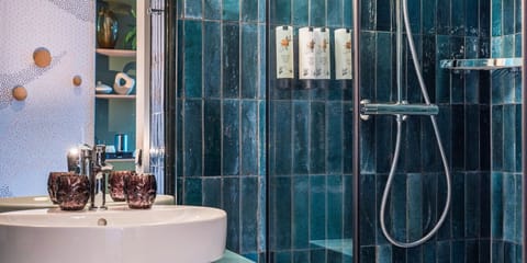 Shower, rainfall showerhead, hair dryer, towels