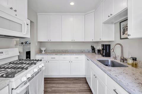 Kitchen: fully stocked with washer and dryer