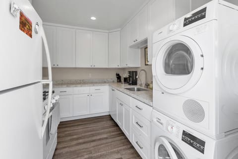 Kitchen: fully stocked with washer and dryer