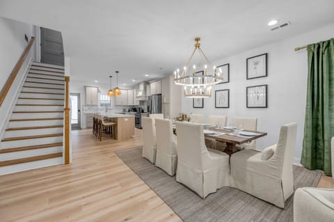 Bright and thoughtfully designed, this dining space includes a generous table and comfy seating, great for eating, entertaining, or unwinding together.