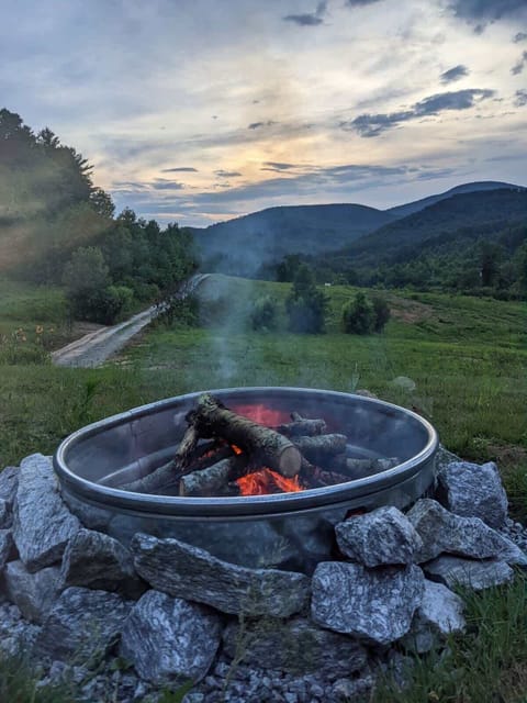 Enjoy the mountain view while sitting by the fire pit.
