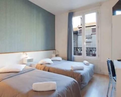 Basic Twin Room | Memory foam beds, individually decorated, individually furnished, desk