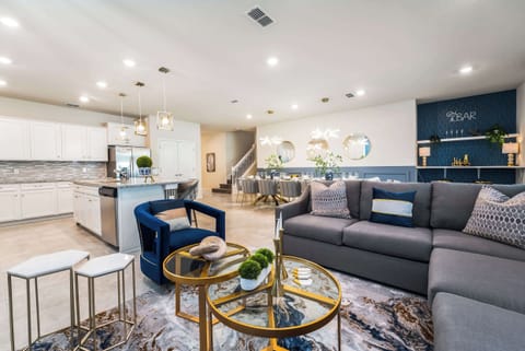 Experience luxury in this expansive living space with a modern kitchen and elegant dining area, perfect for entertaining large groups.