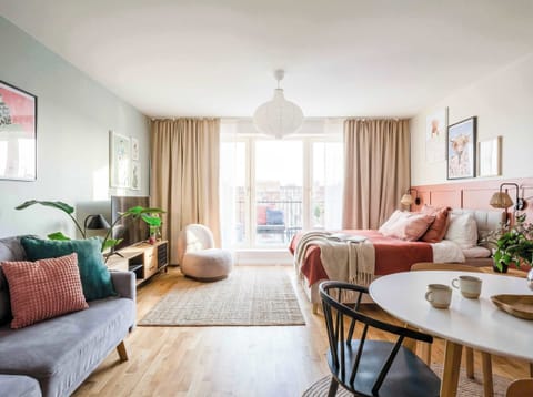 The main room of the apartment with queen size bed, convertible sofa bed, access to terrace and kitchen