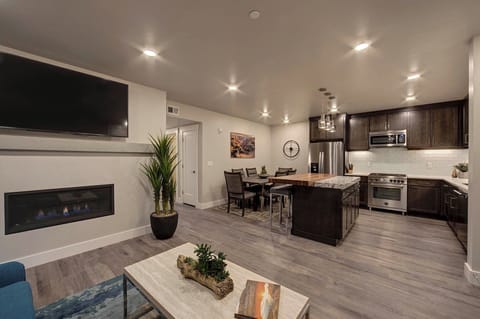 The living area opens seamlessly to the luxury kitchen.(Photos don't depict actual furnishings in the unit)