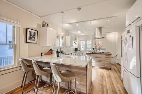 The Monroe Bungalow boasts tons of natural sounth facing light and chefs kitchen