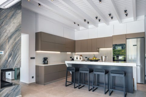 An island counter featuring four stools for casual dining!