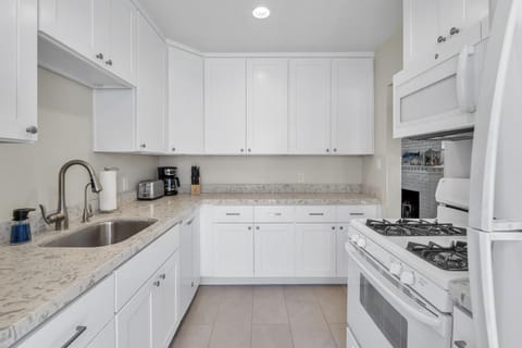 Kitchen: fully stocked with washer and dryer