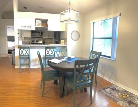 Inside dining, additional 4 chairs in garage enclosed patio seating 4 -10 people