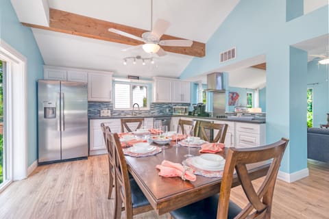 Bright and open, the kitchen and dining space invites you to create and savor meals with effortless indoor-outdoor flow.