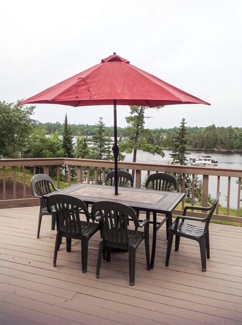 Spacious furnished deck with gas barbecue, overlooking Rainy Lake.