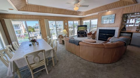 Great room: dining+family room, bar, next to front balcony, & slight ocean view)