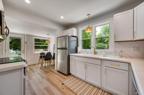 Large and very chef friendly kitchen with additional seating + wine fridge + Coffee Bar