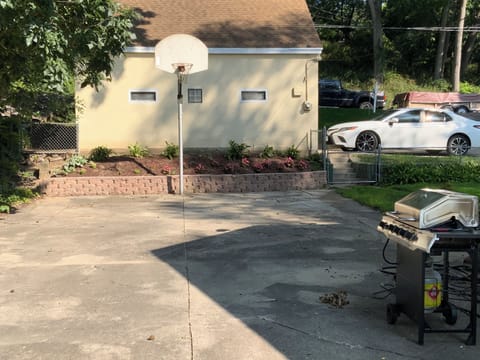 Fenced in yard, gas grill, outdoor games provided in trunk