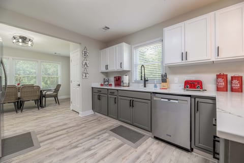 Open kitchen leads right into the dining room with seating for 6.