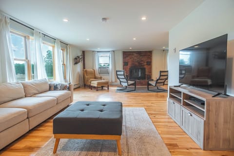 Spacious living room with maple hardwood floors and plenty of natural light.