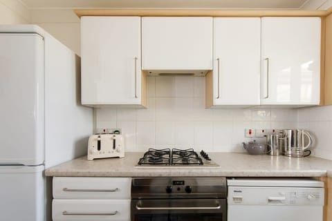 The kitchen has a gas hob, oven, fridge freezer, dishwasher and toaster.
