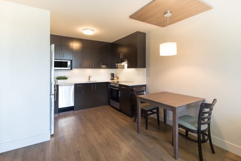 Suite, 1 Bedroom | Private kitchen | Microwave, oven, stovetop, dishwasher