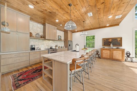 Kitchen: Stylish space for culinary creations, featuring modern appliances and forest views!