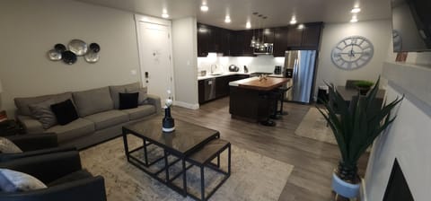 Open-concept living space with contemporary furnishings, a beautiful kitchen, and a cozy living room—designed for comfort and connection.
