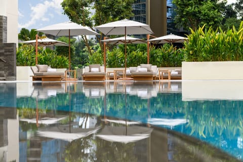 Outdoor pool, open 6:00 AM to 10:00 PM, free cabanas, pool umbrellas