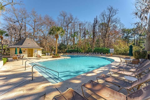 Surrounded by lush landscaping and convenient amenities, it's the perfect spot to unwind and enjoy island living just minutes from the home.