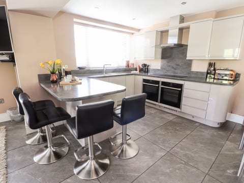 Fridge, electric kettle, cookware/dishes/utensils