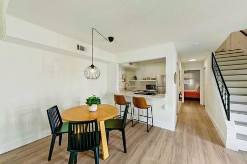 Dining area sits 4 + 2 bar high chairs