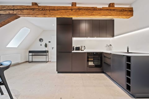 Enjoy the convenience of our contemporary kitchen, featuring stylish cabinetry, modern appliances, and a cozy dining area perfect for intimate meals.