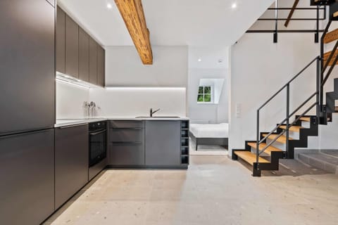 Cook up a storm in our fully equipped, modern kitchen with sleek cabinetry, stainless steel appliances, and ample counter space.