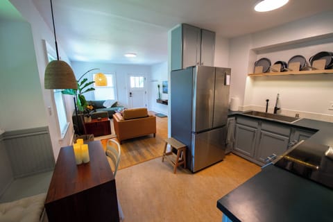 Full kitchen opens to dining area and living room.