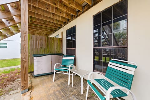 Covered patio area with seating and storage under the deck