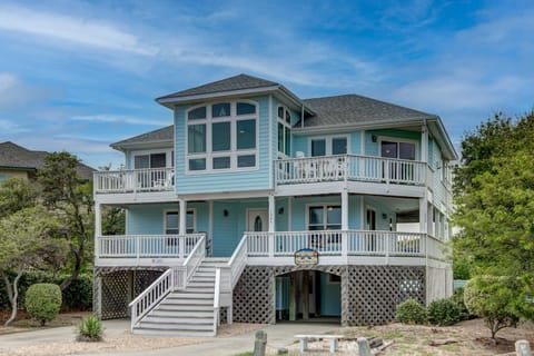 Front Exterior - She's as blue as the sea, this coastal exterior welcomes you home.