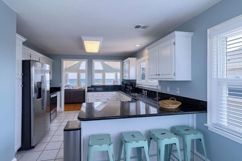 Kitchen Bar - From either end of the kitchen, you can pull up a stool and a meal or the view.