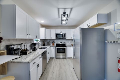 Fully equipped kitchen with modern appliances and ample counter space.