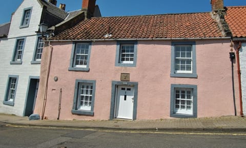 The pretty pink cottage is on the Fife Coastal Path