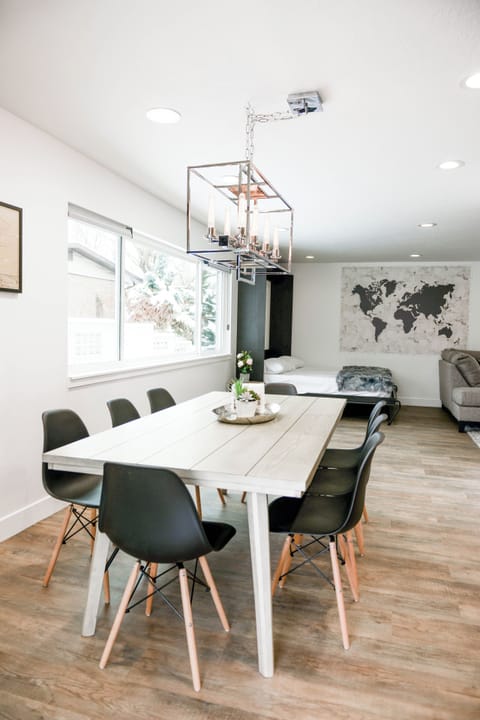 Upstairs dining has a table for eight and window providing lots of natural light
