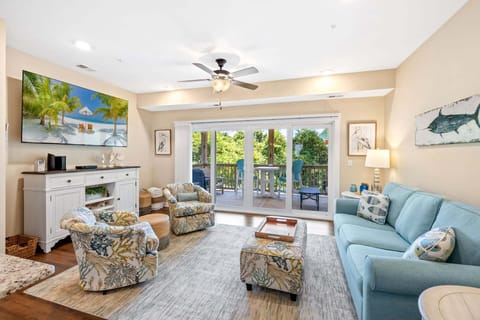 Spend your days in the spacious Living Area with beautiful high ceilings and lots of brilliant natural light coming in through the 12' sliding glass doors.