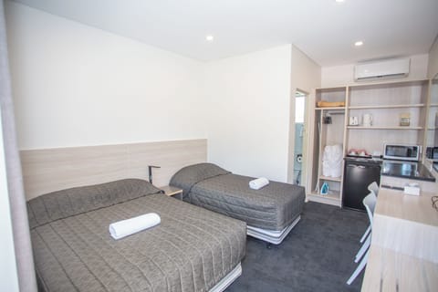 Standard Room (Twin Room) | Iron/ironing board, WiFi (free), bed sheets