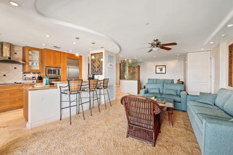 Gather in this spacious open-concept living area with cozy seating and ocean breeze